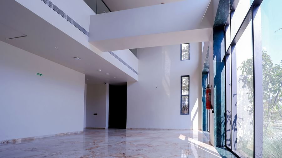 An image of a reception lobby with huge glass widows at Pride Resort Ambaji